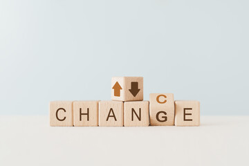 CHANGE and CHANCE text on wooden cube block with flipped one from G to C, and up and down arrow above. For business strategy, new plan, revise planning, growing business, SME concept - obrazy, fototapety, plakaty