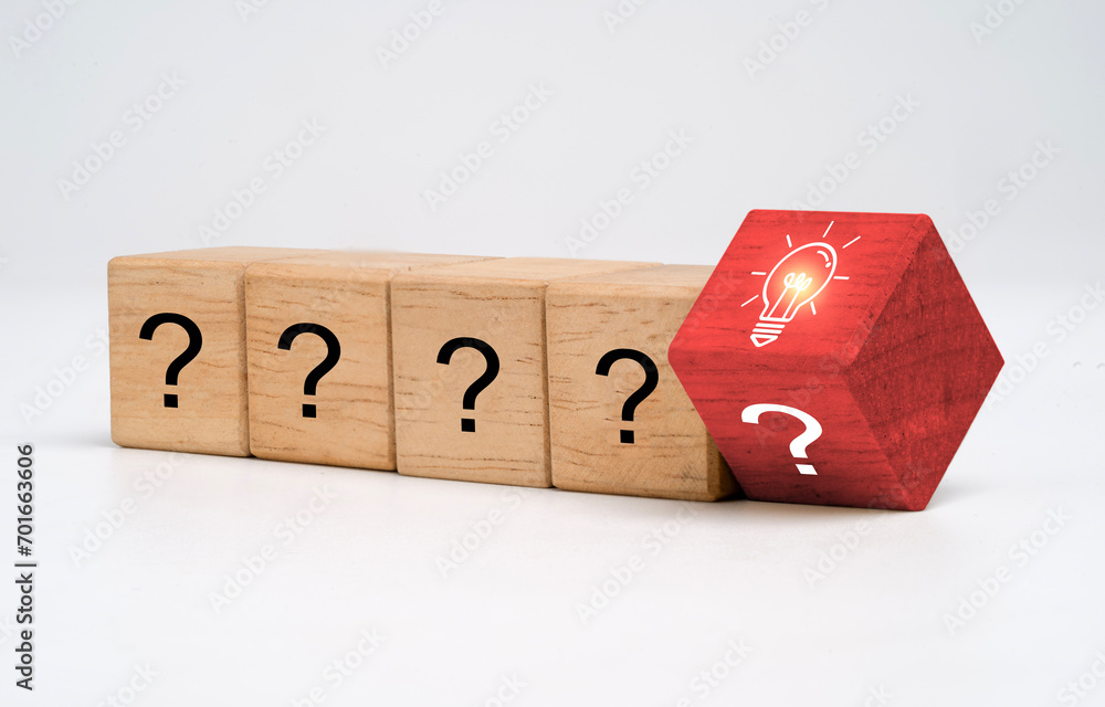 Poster flipping of wooden block cube between glowing lightbulb and question mark for creative thinking idea