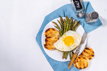 Breakfast with asparagus and fried egg