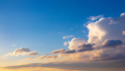 Obraz premium Blue sky background with clouds at sunset