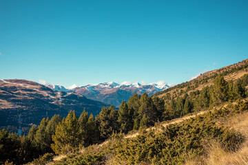 Fototapeta na wymiar Mountains landscape in autumn. View of mountain slopes on a sunny day, Pyrenees, Andorra, Europe