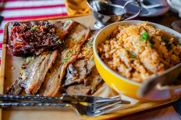 Grilled ribs and prok belly striped served with sauce and java rice