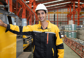 Latino industrial engineer wears safety helmet work in heavy metal engineering factory. Hispanic...