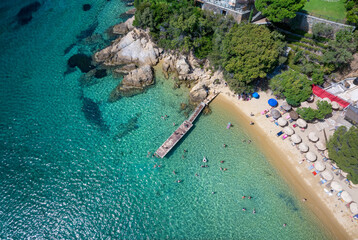 Aerial top view of the turquoise sea at Vromolimnos beach at Skiathos island, Sporades, Greece