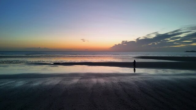 Lone walker at the Beach
