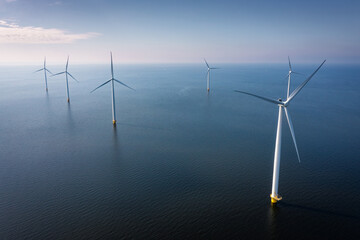 wind turbines at sunset in the sea