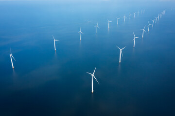 two lined wind turbine park in the sea
