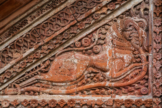 Closeup view of carved terracotta mythological horselike creature on exterior of Chota Anhik ancient hindu temple, Puthia, Rajshahi, Bangladesh
