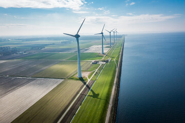 wind turbine at the sea coast - obrazy, fototapety, plakaty