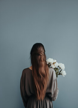 Young Woman Holding White Peonies, Pastel Blue Aesthetic Background With Copy Space