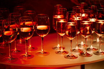 beautiful glasses of wine at an evening festive event
