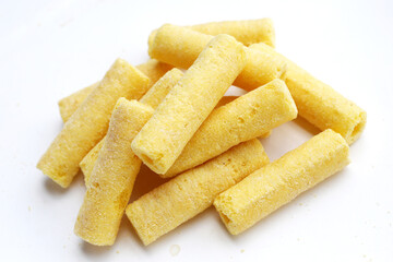 Roller corn snack on white background