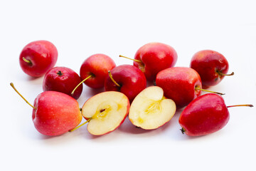 Fresh small red apples on white background