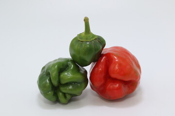 red and green paprikas isolated on white background