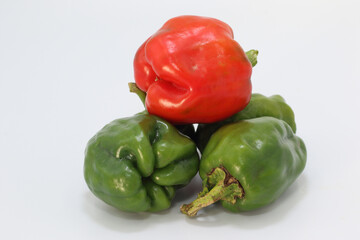 red and green paprikas isolated on white background