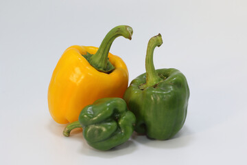 yellow and green peppers isolated on white background