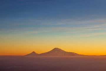 Colorful sunset over the Ararat mountains at winter as seen from the Aragats. Travel destination...