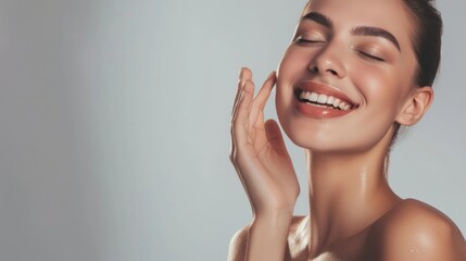 Skincare. Woman with beautiful face touching healthy facial skin. Woman smiling while touching her flawless glowy skin with copy space for your advertisement, skincare - Powered by Adobe