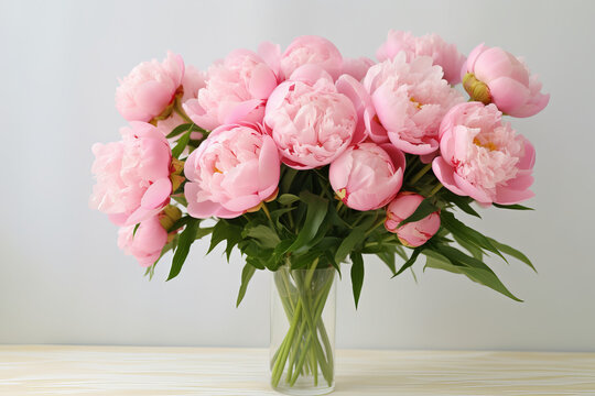 Bouquet of Pink Peonies on White Background Elegant bouquet of soft pink peonies, full and lush, arranged against a pure white background . Generative AI,