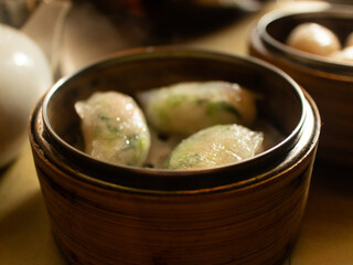 Dim Sum in bamboo steamer, Chinese cuisine. Closeup rustic. horizontal