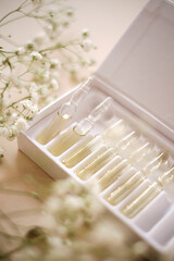 Transparent cosmetic ampoules in a box