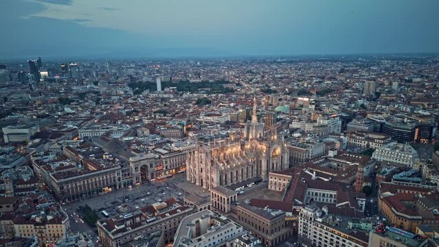 
Aerial Hyper lapse Time Lapse of Milan Cathedral Illuminated Piazza Del Duomo Di Milano And Milano Skyline At Dusk, 4K Footage in Milan Italy