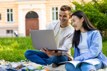 Young couple studying together and looking involved