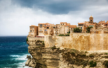 Fototapeta na wymiar The Dramatic Cliff with the Old City of Bonifacio on the Southern Tip of Corsica, France