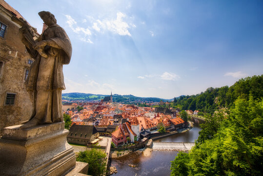 Beautiful Cesky Krumlov in the Czech Republic, as Seen from the Cloak Bridge, with a Statue of a Catholic Saint Holding a Crucifix