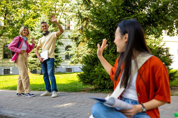 Cute long-haired girl in the park preparing to the exam