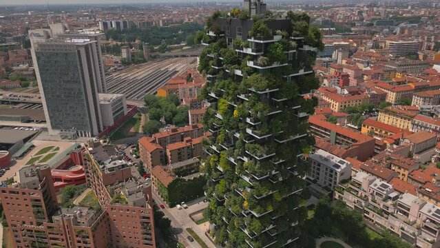 Aerial close up view of ecological modern architecture skyscrapers with green trees on every balcony. Bosco Verticale residential towers in Milan, Italy. 4k Milan city skyscrapers