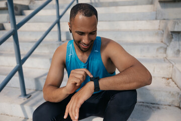 Young man in sportswear on the stairs after a good workout