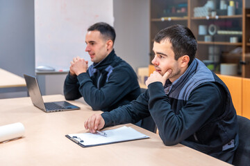 Engineers concentrated during a meeting in a logistics factory