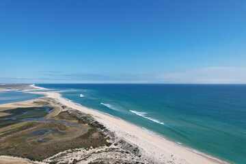 aerial drone view of climate in praia da fuseta in algarve portugal atlantic ocean and nature