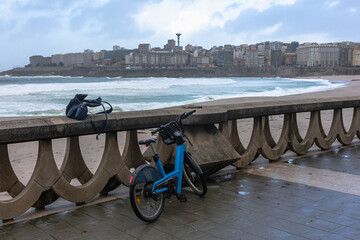 Paused Journey: Bike and Bag Resting by the Seashore