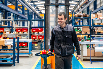 Man carrying a chart in a corridor of a logistic factory © unai