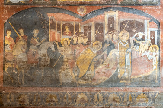 Detail of medieval fresco in ruins painted on wall of historic Basilica in Rome showing a christian scene