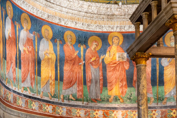 Detail of old religious fresco painted on wall of historic Basilica in Rome showing Jesus...