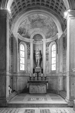 Black and white photo of little altar and chapel inside historic Basilica in Rome