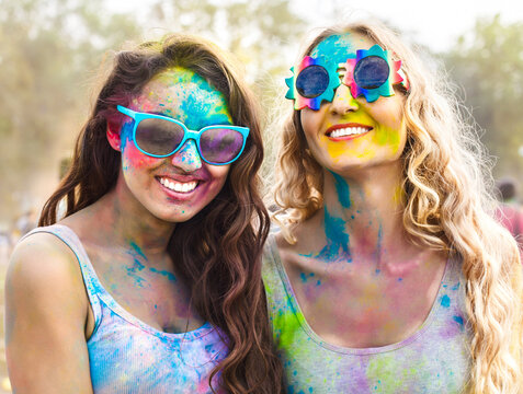 Portrait of happy girls on holi color festival