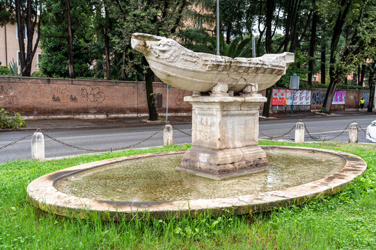Ruins of ancient boat sculpted in marble exhibited in public square in Rome