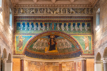 Religious frescoes and mosaics decorating the interior walls of historic Basilica in Italy