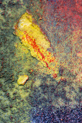 Multi coloured paint on old wall