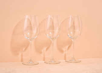 Three empty champagne or wine glasses stand on the table. Luxury alcohol vacation.