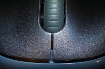 Close-up of a computer mouse on a dark background