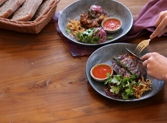 top view of friends lunch with steak meat and salad