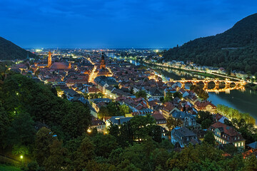 Heidelberg, Germany. Evening view over the Heidelberg Old Town with Jesuit Church, Church of the Holy Spirit and Old Bridge (Karl Theodor Bridge) across the Neckar river. - 701756673