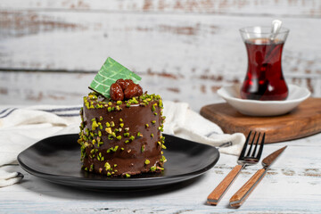 Pistachio cake. Chocolate and pistachio cake on a white background
