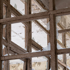 Fototapeta premium old wooden window frames in an abandoned stores building