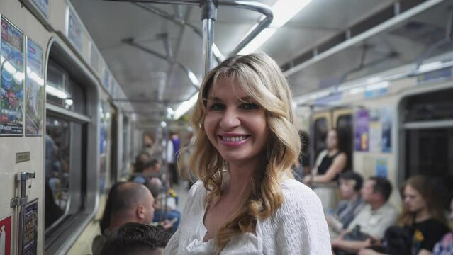 close blond woman in subway car portrait 4k